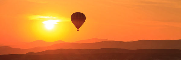 panoramic-canvas-print-hot-air-balloon-at-sunset-panorama