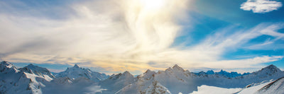 panoramic-canvas-print-over-the-snowy-peaks-panorama